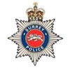 The logo of Surrey Police